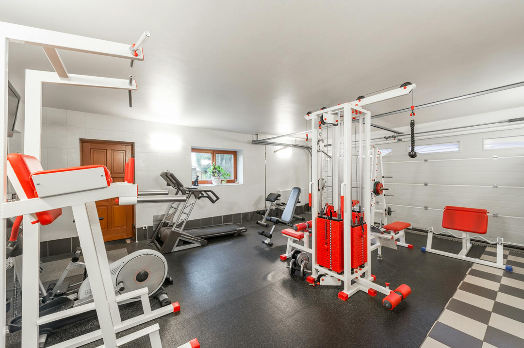 Red and white home gym in garage